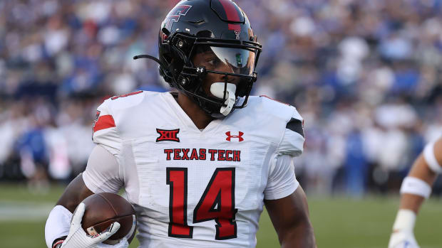 Oct 21, 2023; Provo, Utah, USA; Texas Tech Red Raiders wide receiver Xavier White (14) makes a catch and runs for a touchdown against the Brigham Young Cougars in the second quarter at LaVell Edwards Stadium. Mandatory Credit: Rob Gray-USA TODAY Sports  